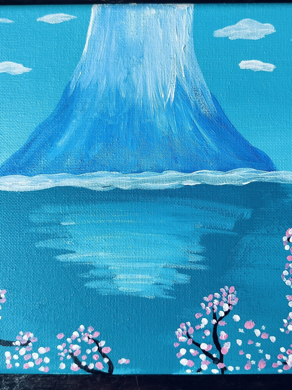 Tranquil Blue Mountain Canvas with Pink Blossom Accents